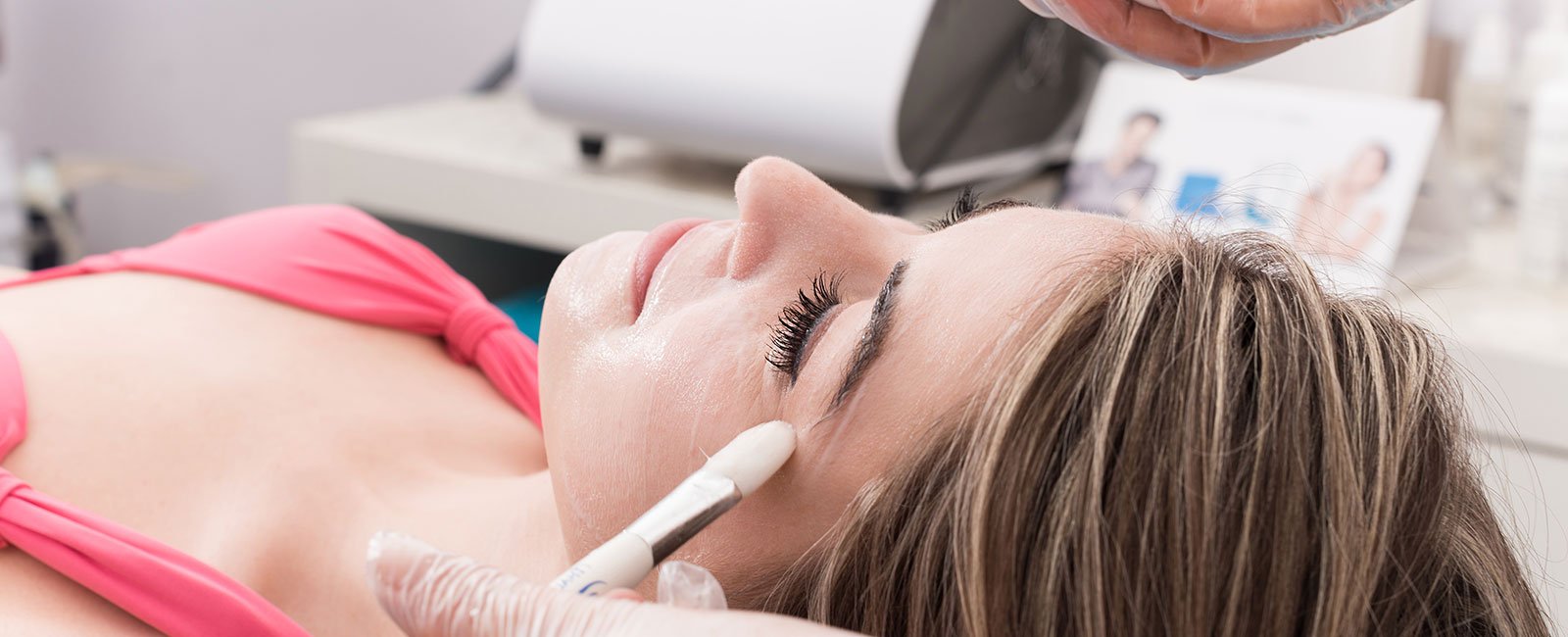 Woman receives chemical peel at spa