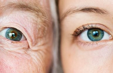 Two blue eyes: one older with wrinkles