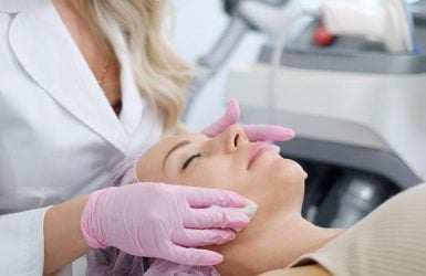 Woman gets laser facelift in clinic; eyes closed
