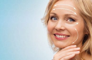Woman with arrows on face for rejuvenation