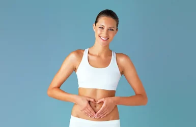 Woman in athletic wear smiles