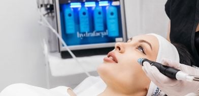 A person gets a HydraFacial with a device