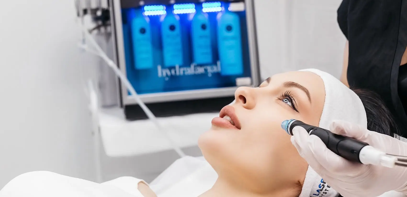 plastic-surgery-hawaii-hero-1 A person gets a HydraFacial with a device