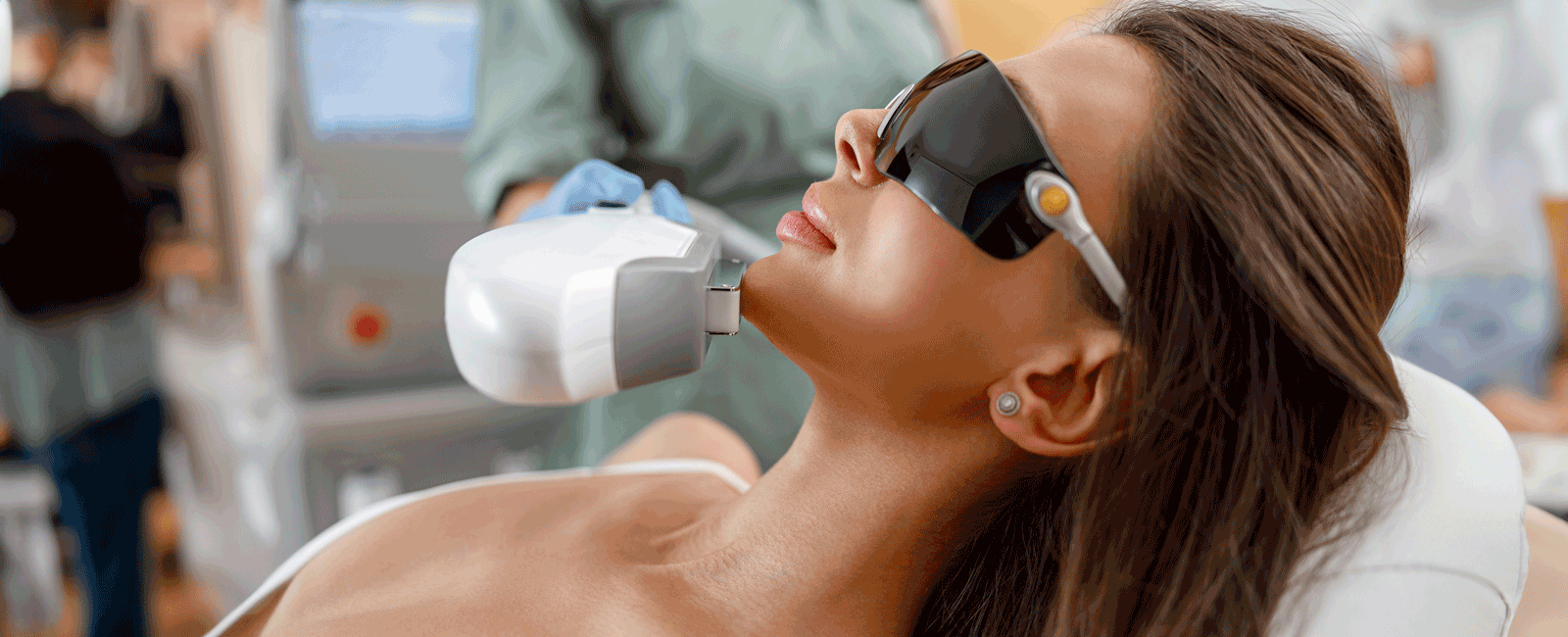 Woman gets facial laser treatment
