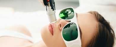 Laser hair removal on upper lip; person wears goggles
