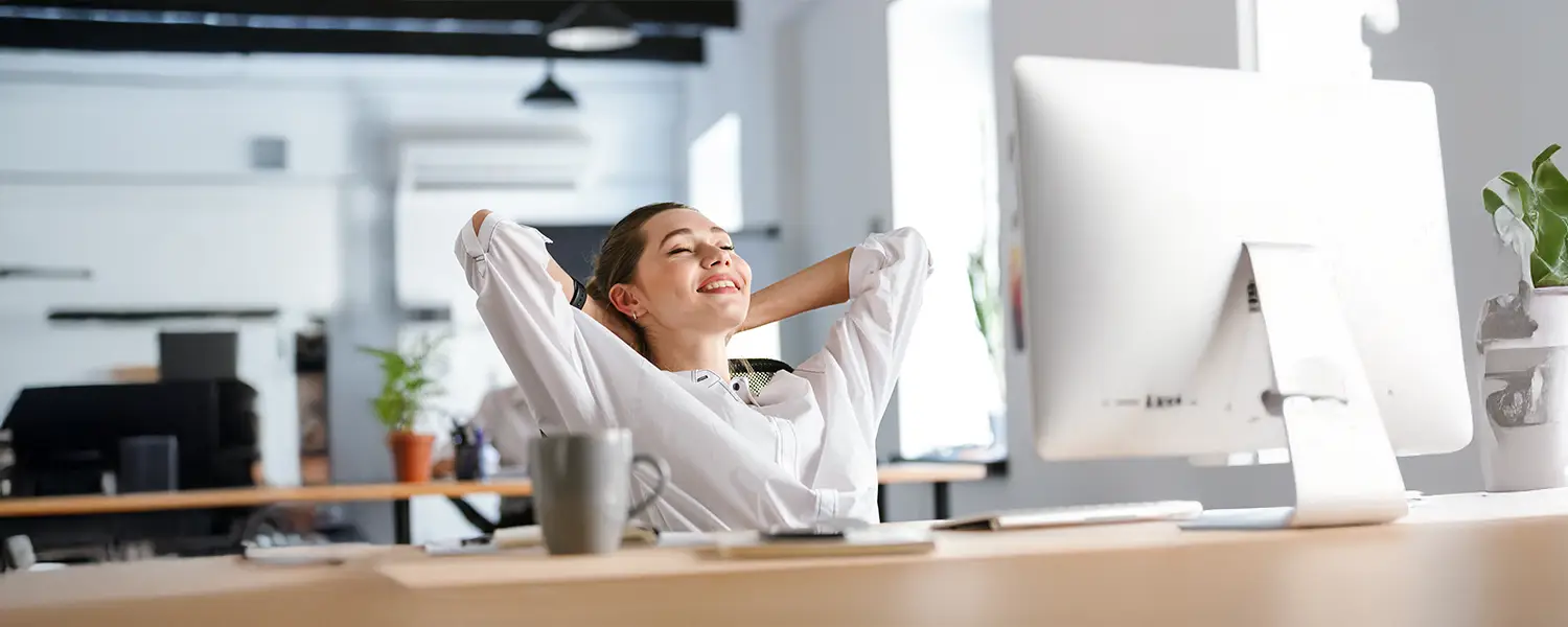 plastic-surgery-hawaii-hero-1 Woman in white shirt relaxes at desk